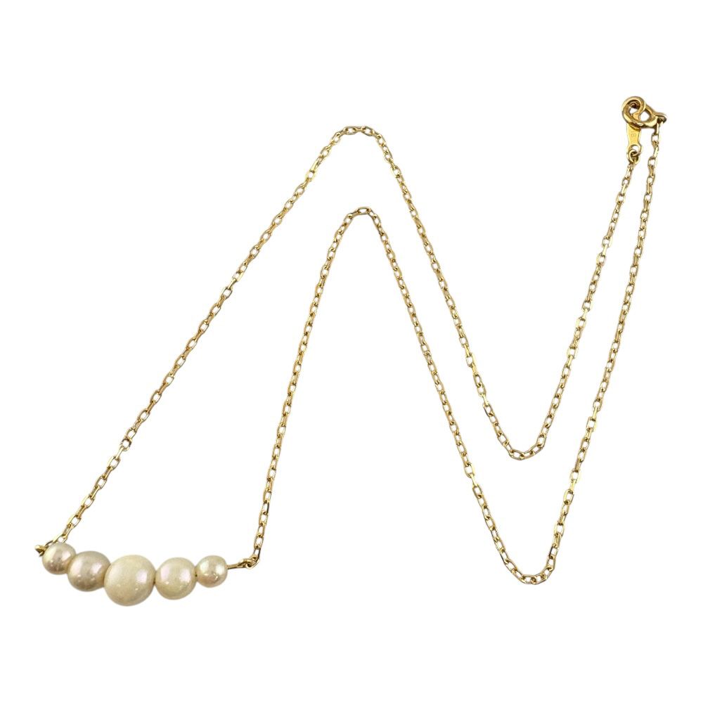 Mikimoto 18K yellow gold pearl necklace for ladies weighing 2.3 grams shown on white background