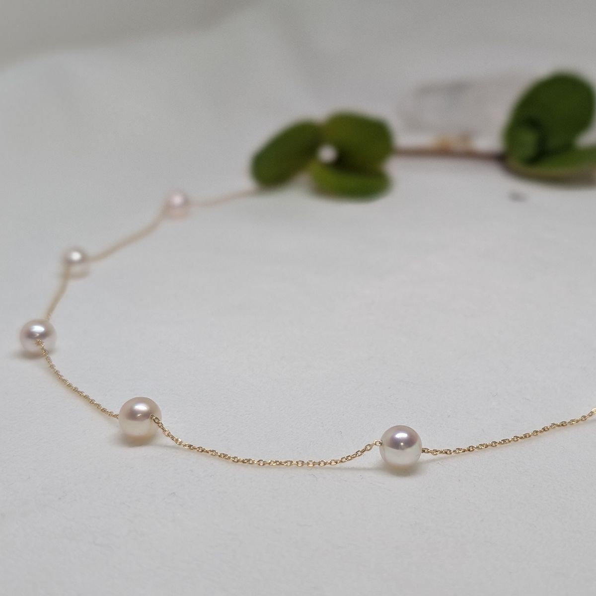 Akoya pearl necklace with white round pearls, 18k gold, 18 inches long