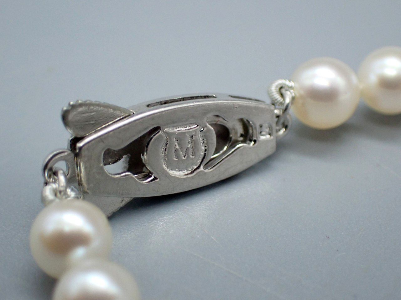 MIKIMOTO Akoya Pearl Necklace with 5.5mm pearls, 38cm length, displayed with original case