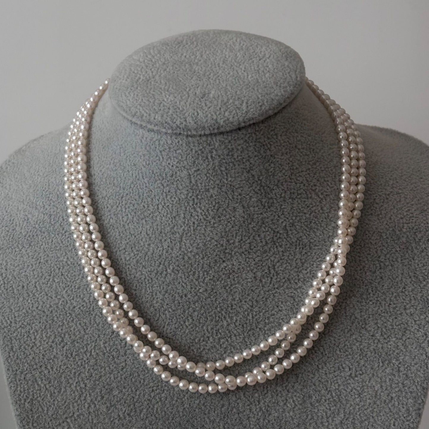 188 Tasaki silver three-row necklace featuring baby pearls and a ribbon clasp, 42.5 cm length