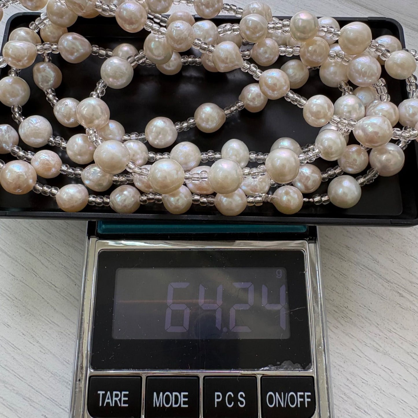 Long necklace featuring lustrous baroque Akoya pearls and crystal beads measuring about 120cm