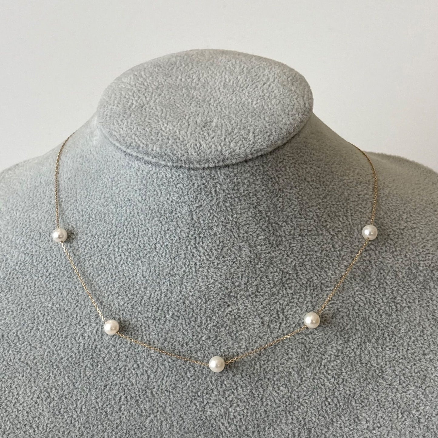 094TasakiK18 pearl 5-string station necklace displayed with box and warranty