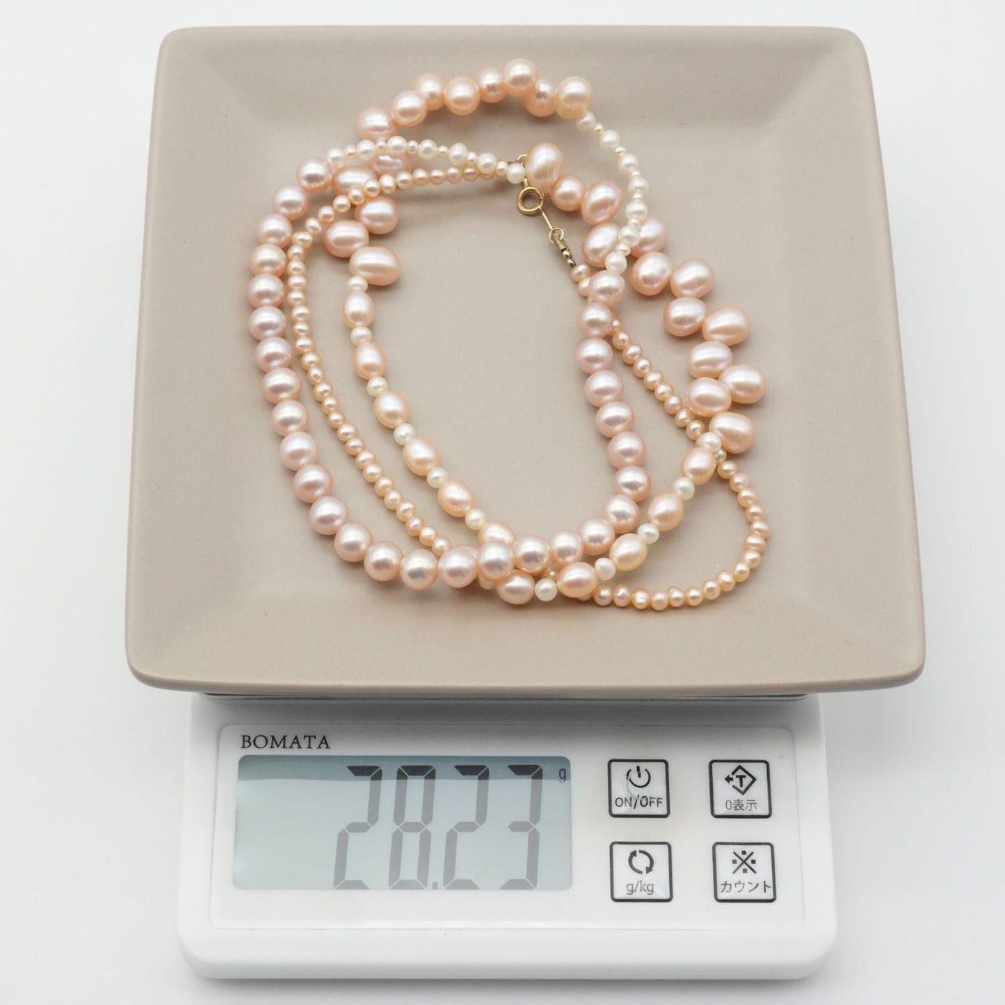 Agete K10 gold long necklace featuring pink freshwater pearls displayed on white background