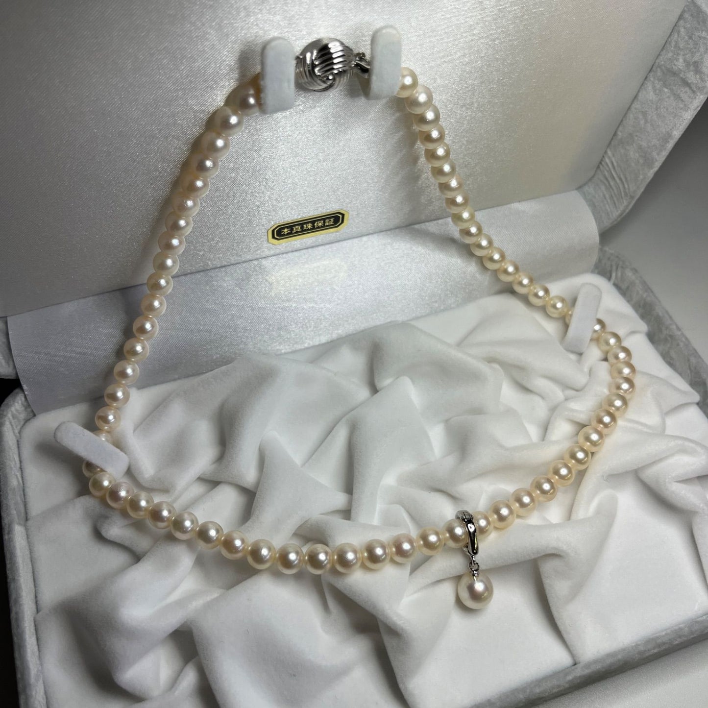 Akoya genuine pearl necklace with 6.0-6.5mm pearls and sterling silver fittings displayed with case