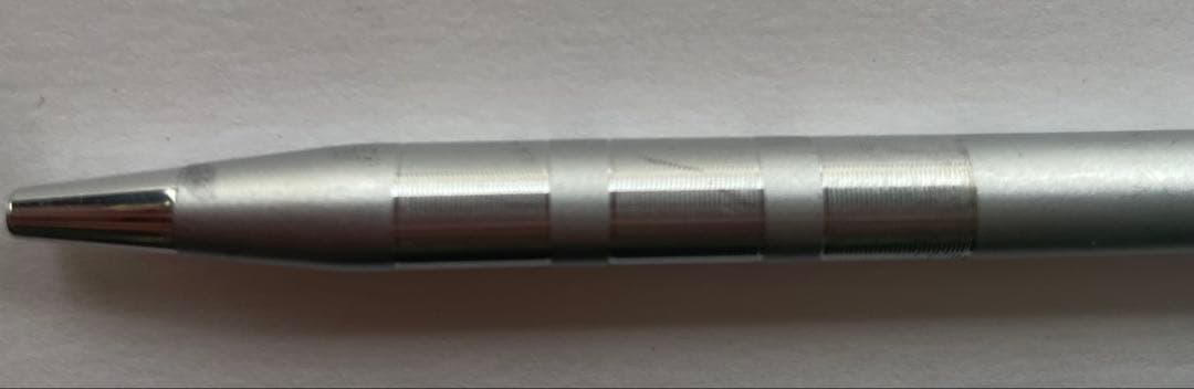 Silver Cross ballpoint pen with black ink, rotating type, shown with slight scratches