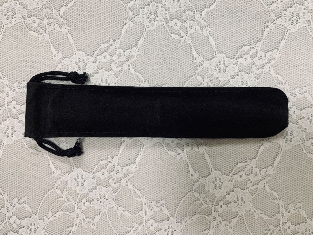 CROSS ballpoint pen with black ink, twist mechanism, key-shaped and heart-shaped charms, and pen pouch
