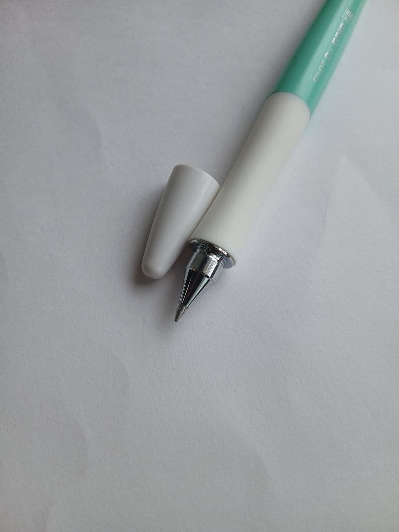 Close-up of a discontinued PILOT Dr.GRIP antibacterial ballpoint pen with visible logo and grip