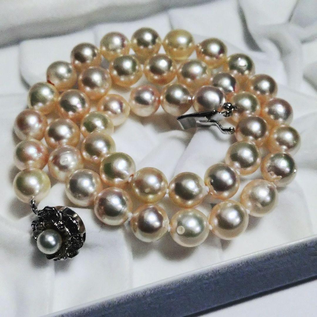 Akoya pearl necklace featuring 9.3mm pearls with a silver stamp weighing 48.7 grams