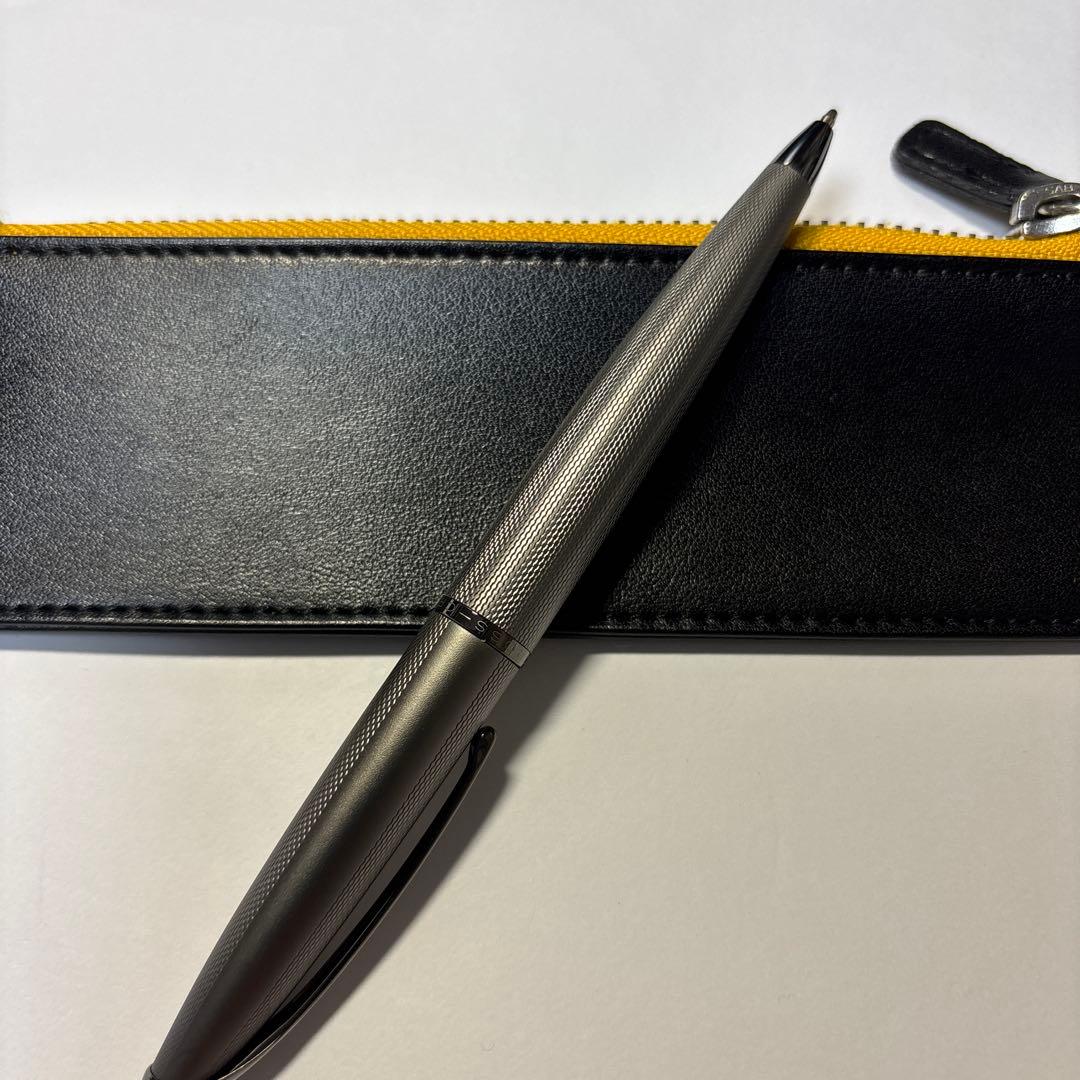 Silver CROSS ballpoint pen with metal body and matching pen case on a white background