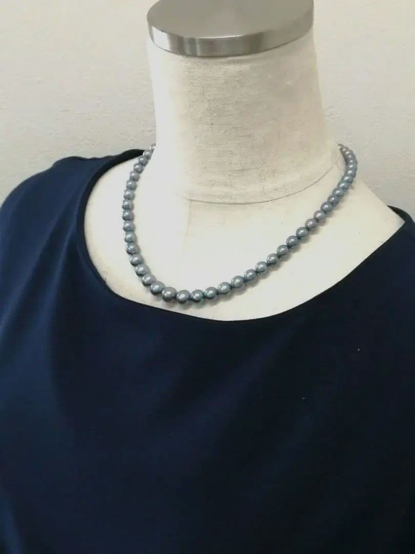 Akoya pearl necklace with blue dyed round pearls sized 9.1-6 mm on a 43.5 cm string with visible luster