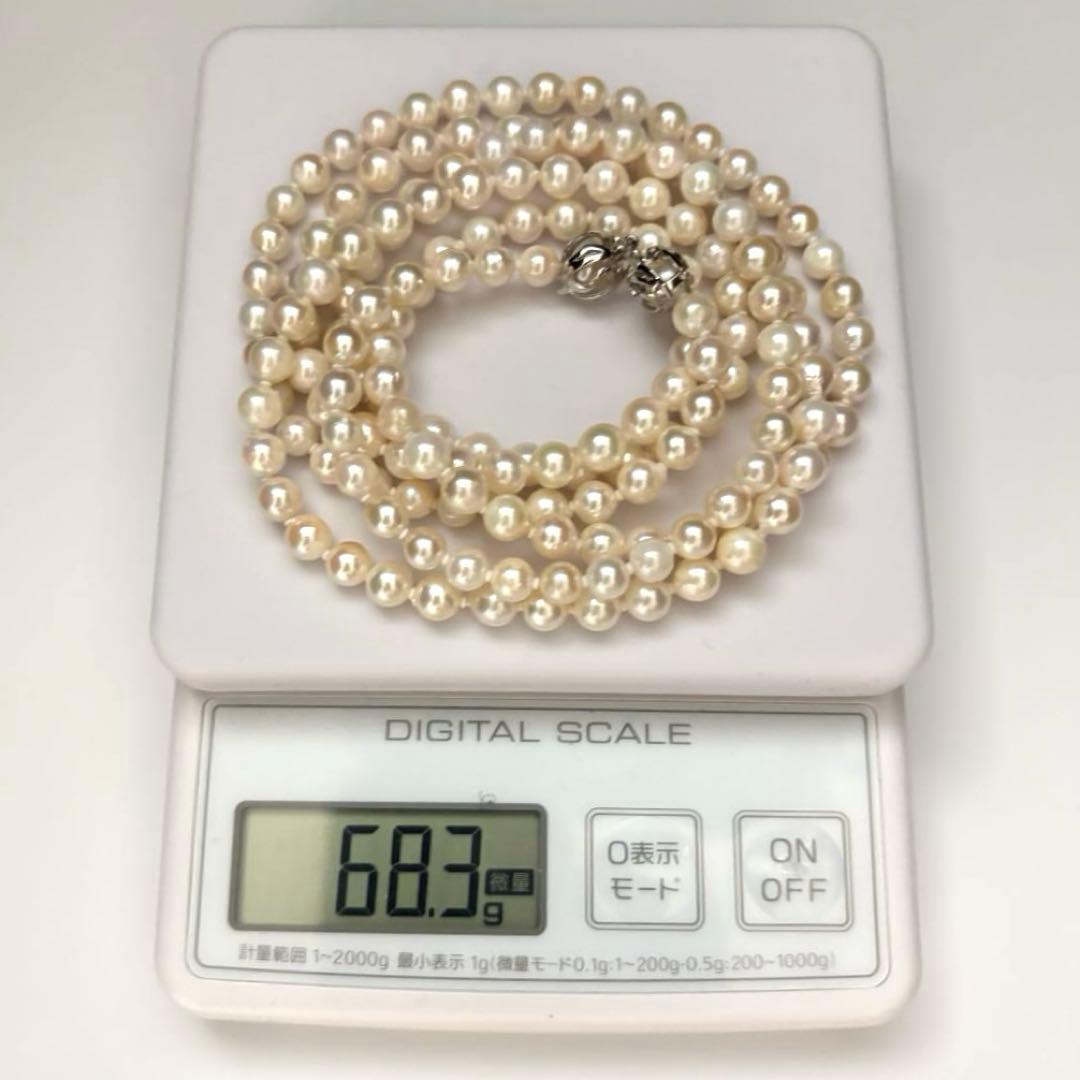 Long 121cm triple strand Akoya pearl necklace with 7.5mm pearls and silver clasp