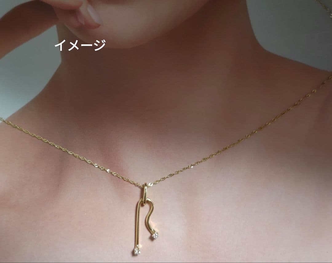 MIKIMOTO K14 yellow gold pendant top featuring 2 diamonds weighing 1.10 grams