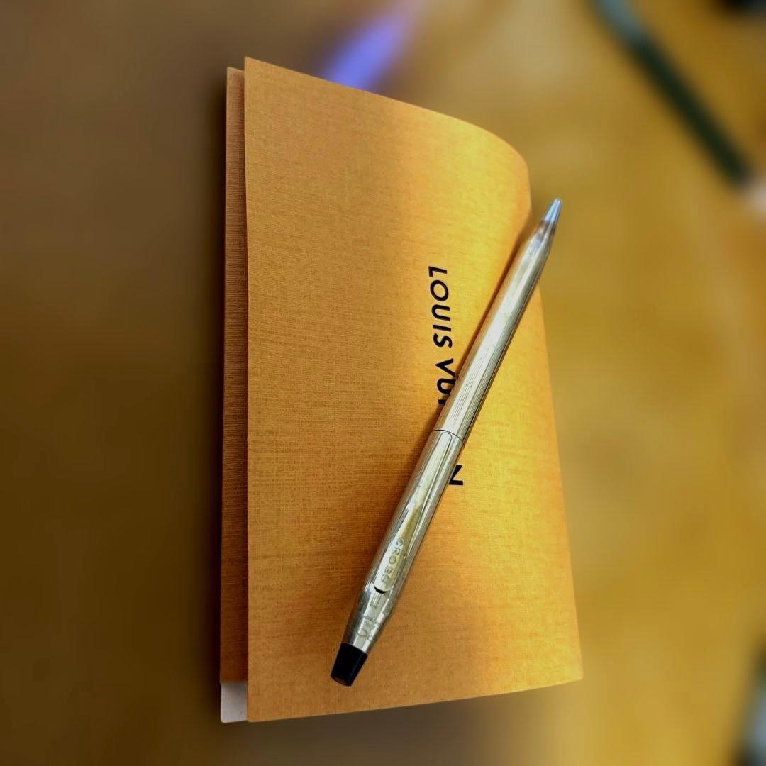 Classic Century gold plated ballpoint pen with twist action made in USA on white background