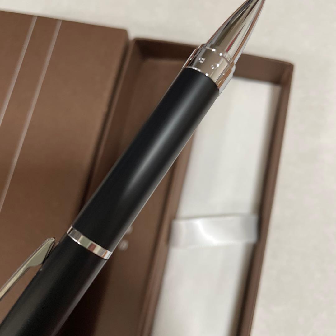 Cross Ballpoint Pen Model CROSS with sleek silver finish and black grip shown on white background
