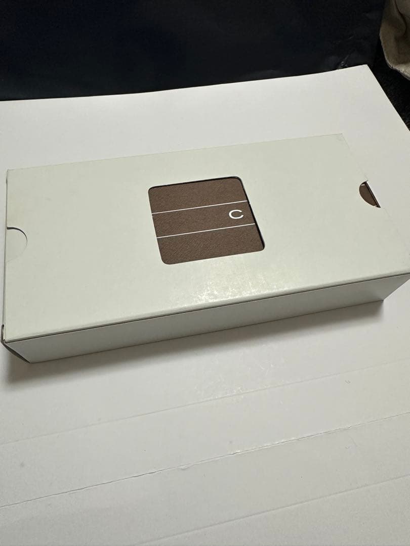 White CROSS ballpoint pen with heart and key charm and metal construction, shown with a protective case