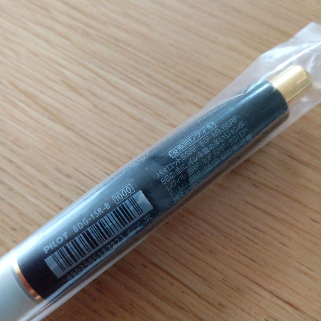 Pilot Dr. Grip fine tip black ballpoint pen with gold plating and black barrel, discontinued model