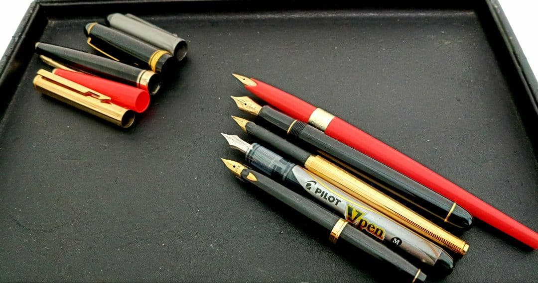 Set of 5 fountain pens including PILOT brand with 21K and 14K gold nibs in black, red, and silver colors