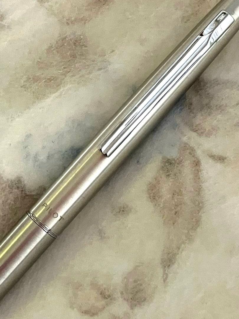 Set of two CROSS and PILOT ballpoint pens with minor scratches shown on the pen bodies