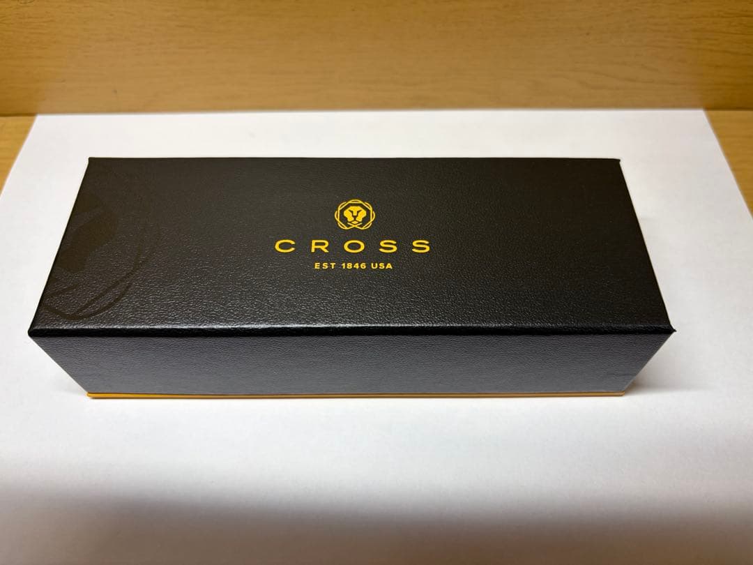 Gold CROSS multi-function ballpoint pen with dedicated case on white background