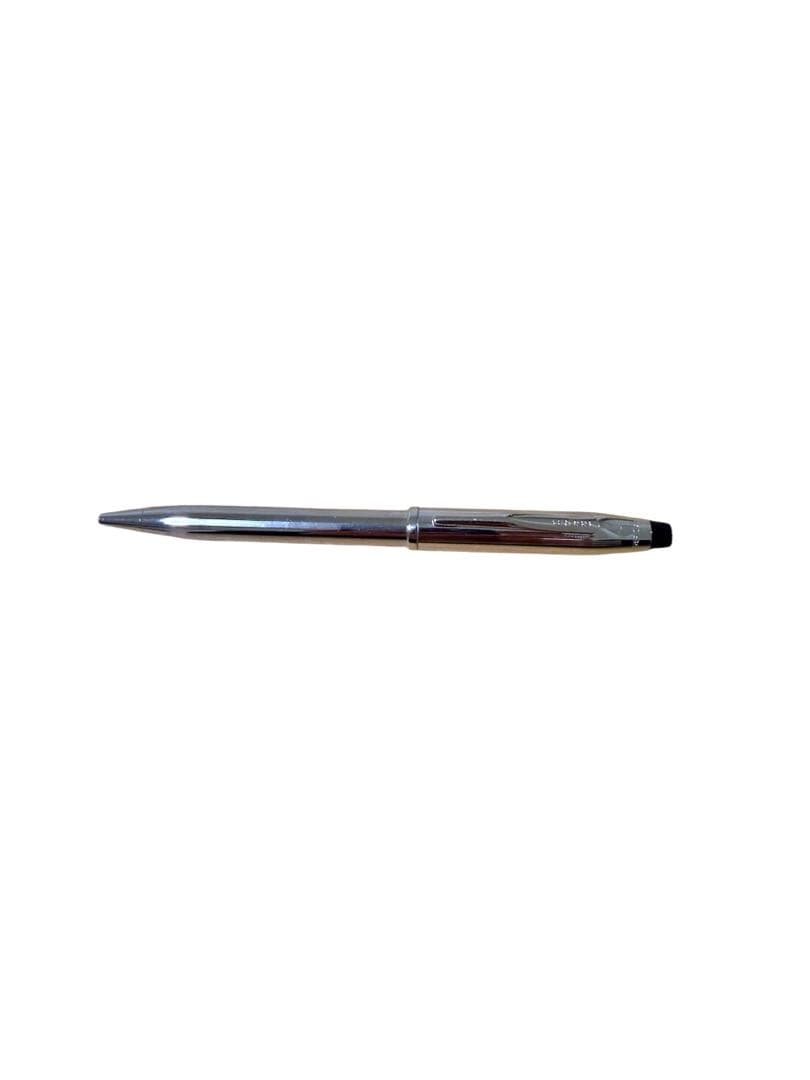 Cross silver ballpoint pen with clip and red ink refill shown on white background