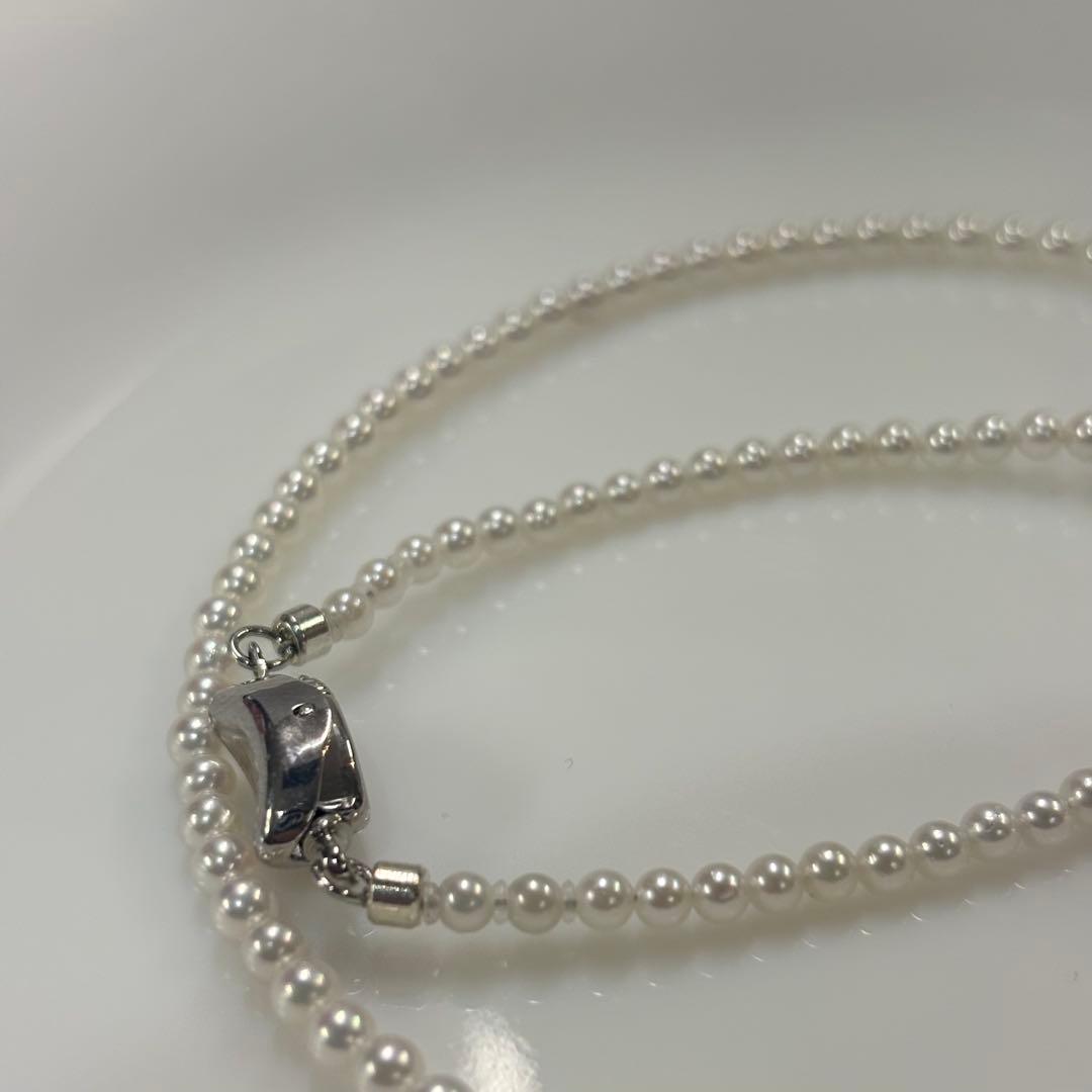 Uncolored Akoya pearl necklace with 3-3.5mm baby pearls and 42cm length featuring a 925 clasp