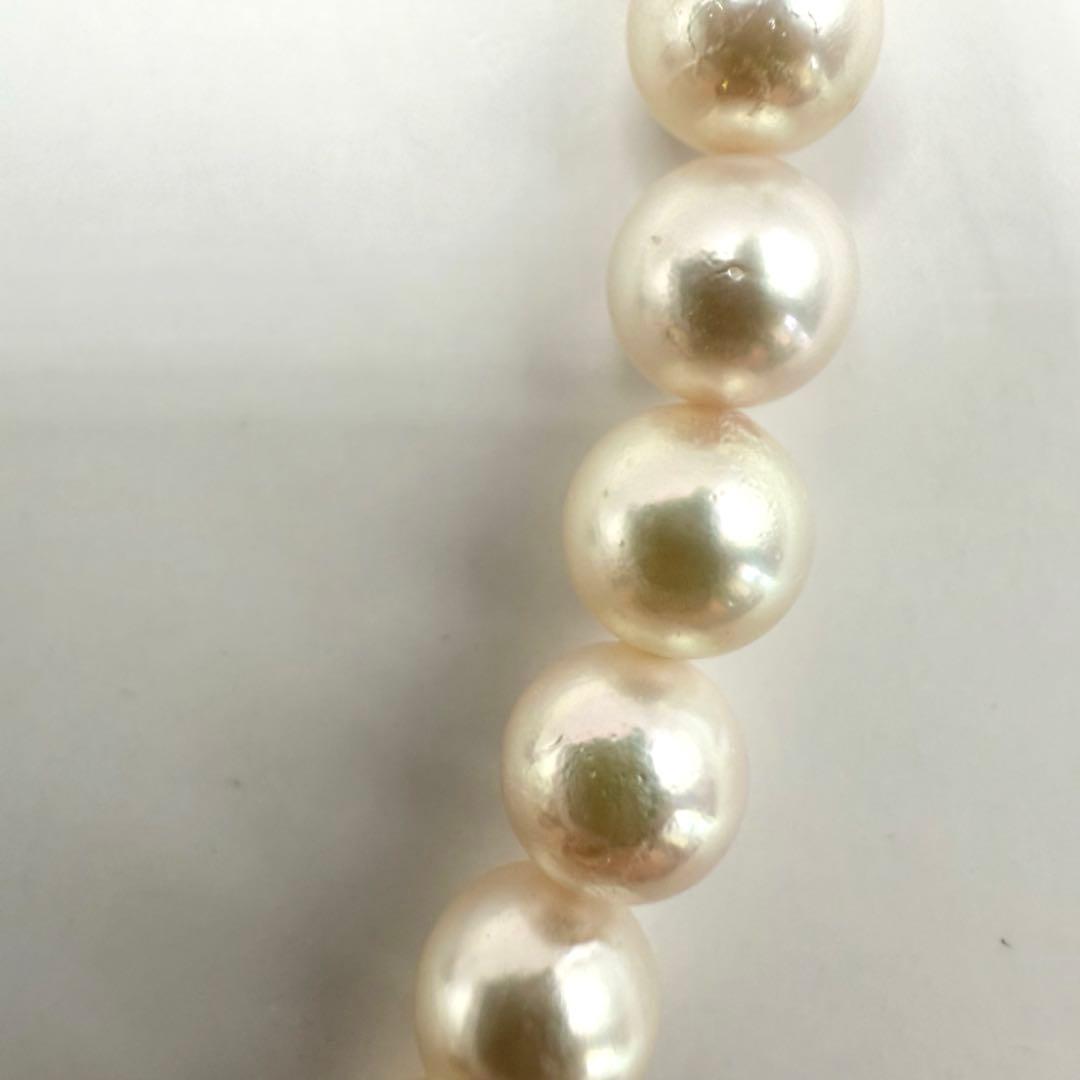 Yamato Akoya pearl necklace with 6mm pearls measuring 42cm displayed on a white background