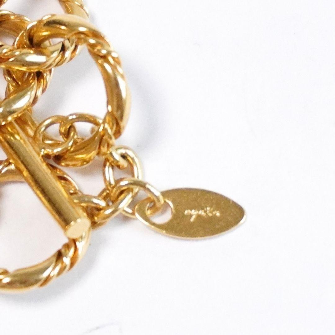 Agete 5-row gold necklace with long adjustable chain showing its length and clasp