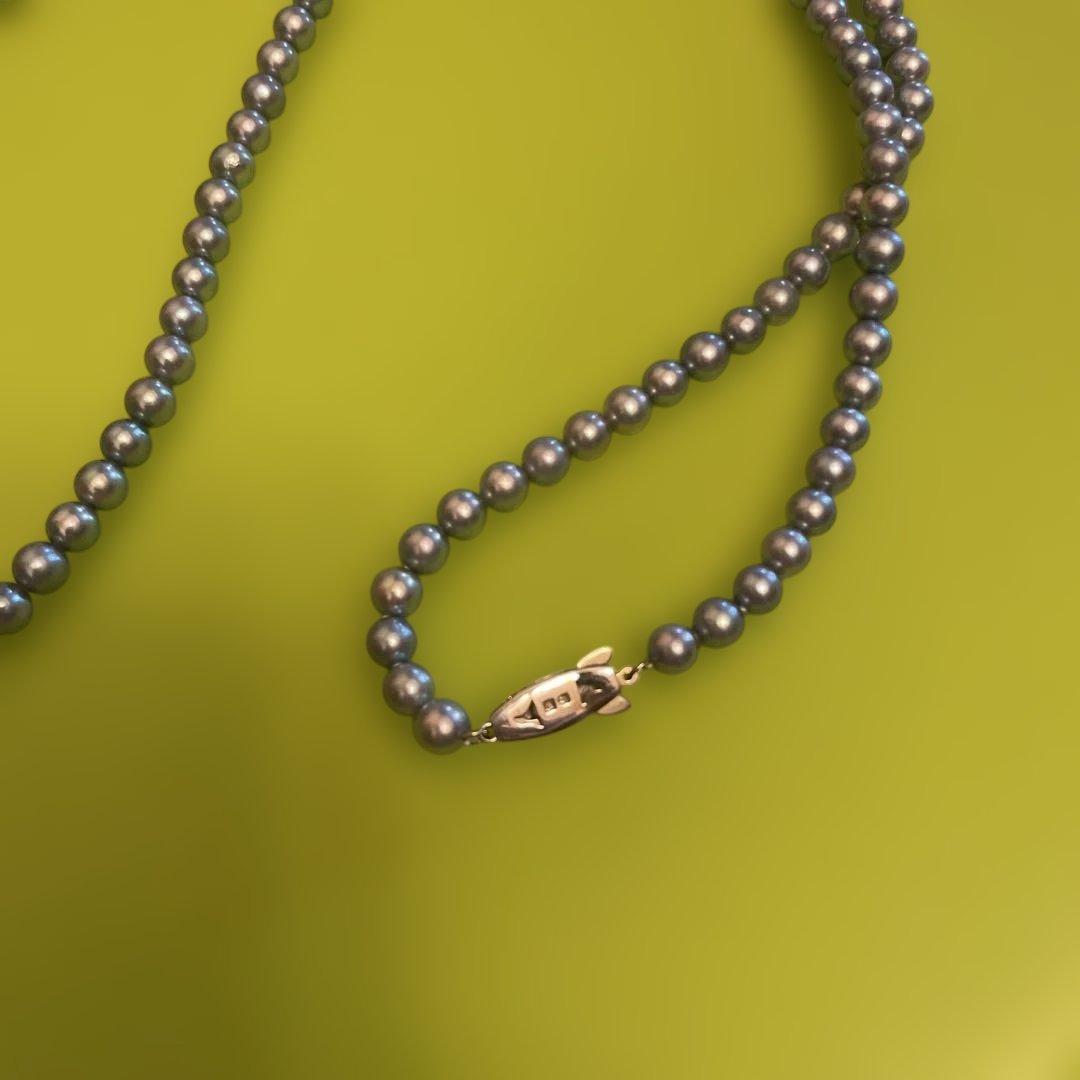Tasaki silver pearl necklace with fish-shaped clasp, approximately 80 cm long