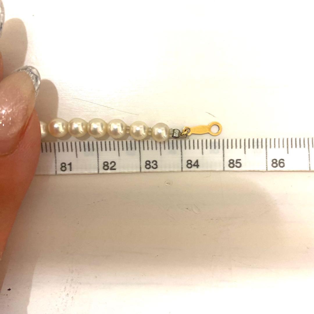 MIKIMOTO K18 gold long necklace with 5mm white pearls, 85cm length, displayed on a white background