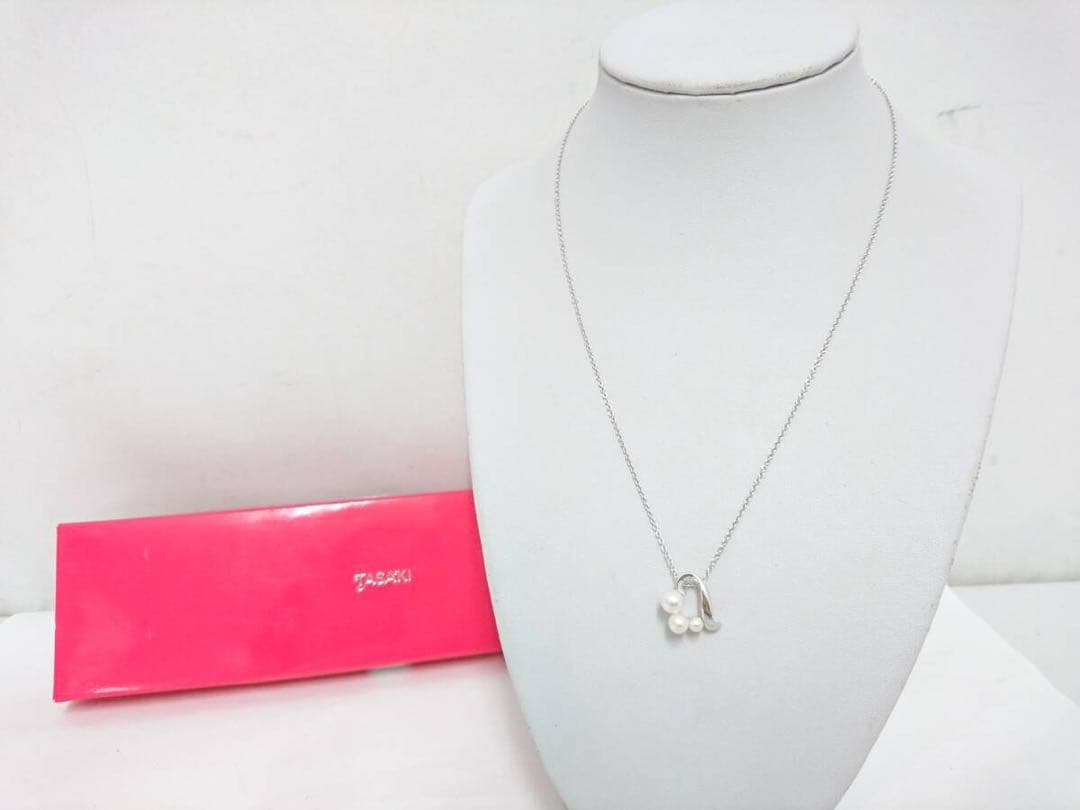 Tasaki pearl necklace made of silver SV925 with round white pearls displayed on a white background