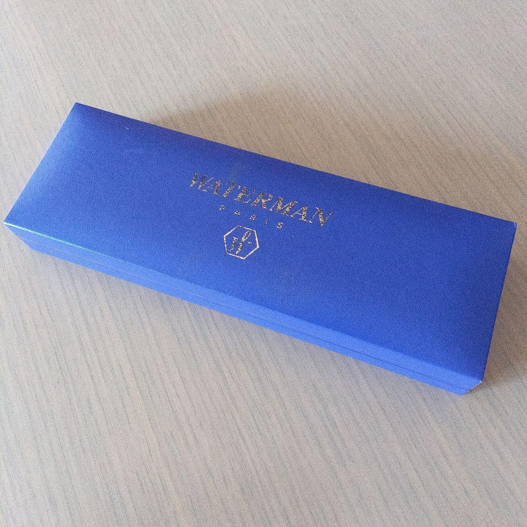 Waterman black ballpoint pen with gold metal fittings and plastic body displayed with dedicated case