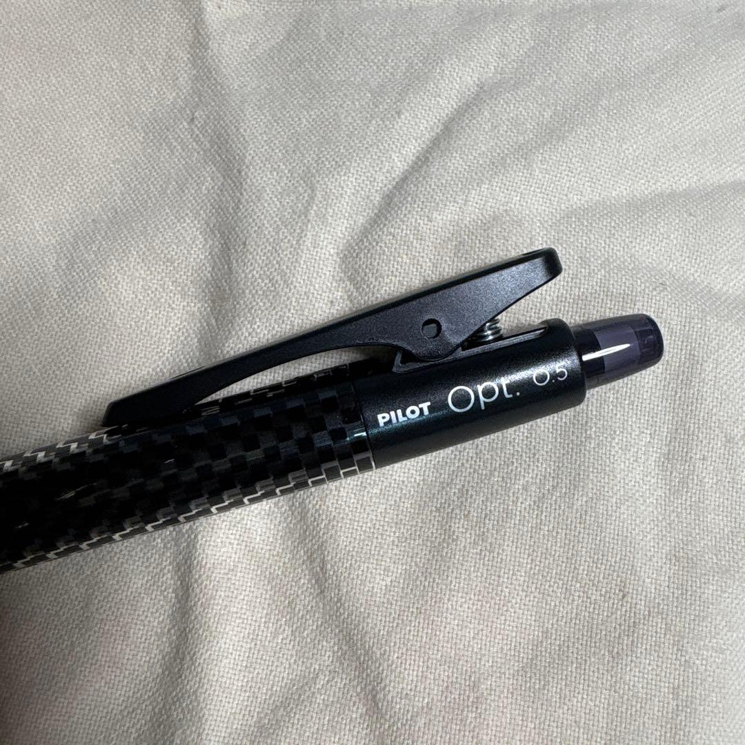 Set of 10 PILOT Opt.6 black mechanical pencils made of carbon fiber shown in a neat arrangement