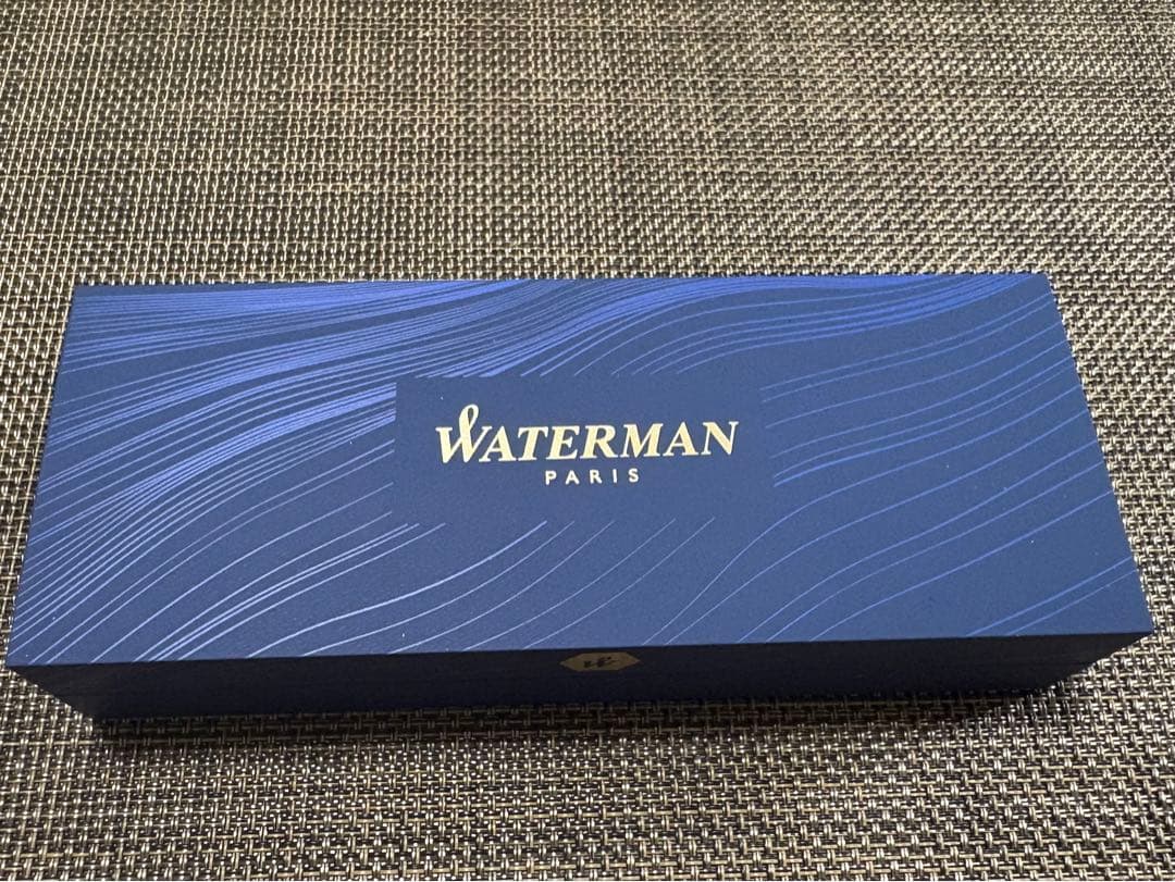 Waterman black ballpoint pen shown with its dedicated black case on a white background