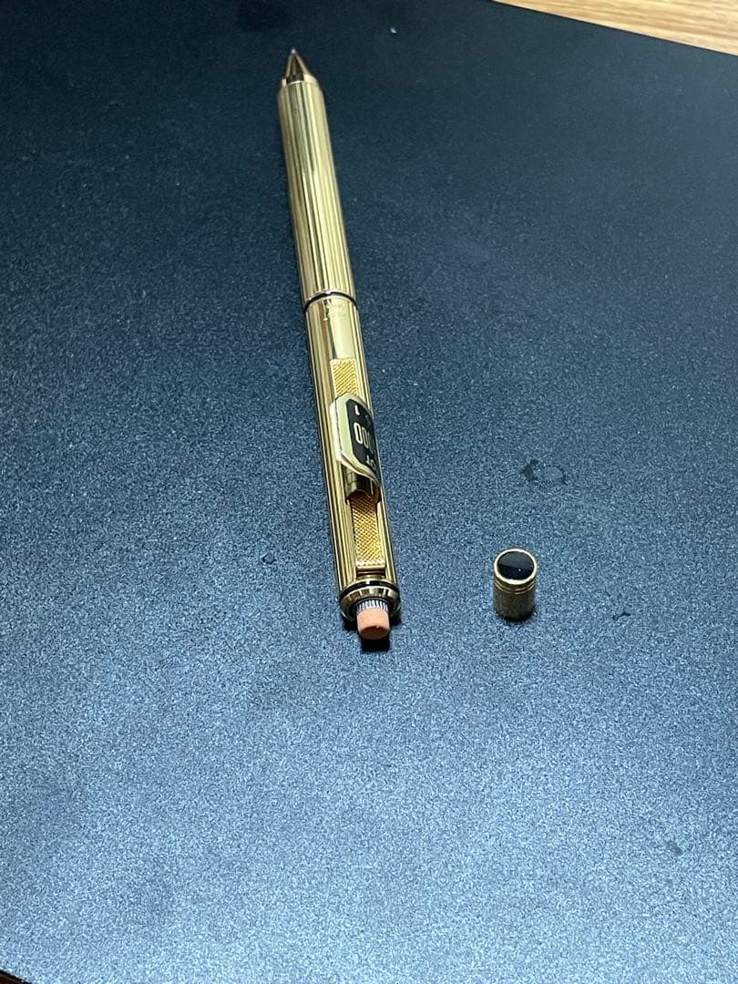 PILOT Mechanical Pencil Ballpoint Pen in gold color lying on a white background