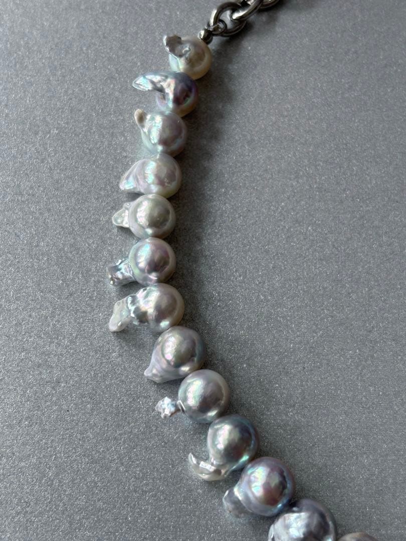Elegant Akoya Pearl Feather Pearl Necklace with 7.5-8.7mm pearls and adjustable chain displayed on white background