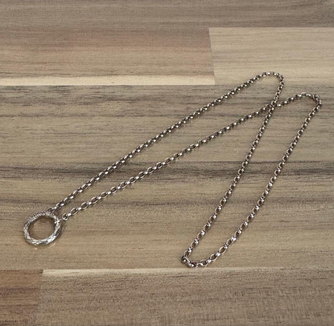 agete silver diamond necklace with a single sparkling diamond on delicate chain