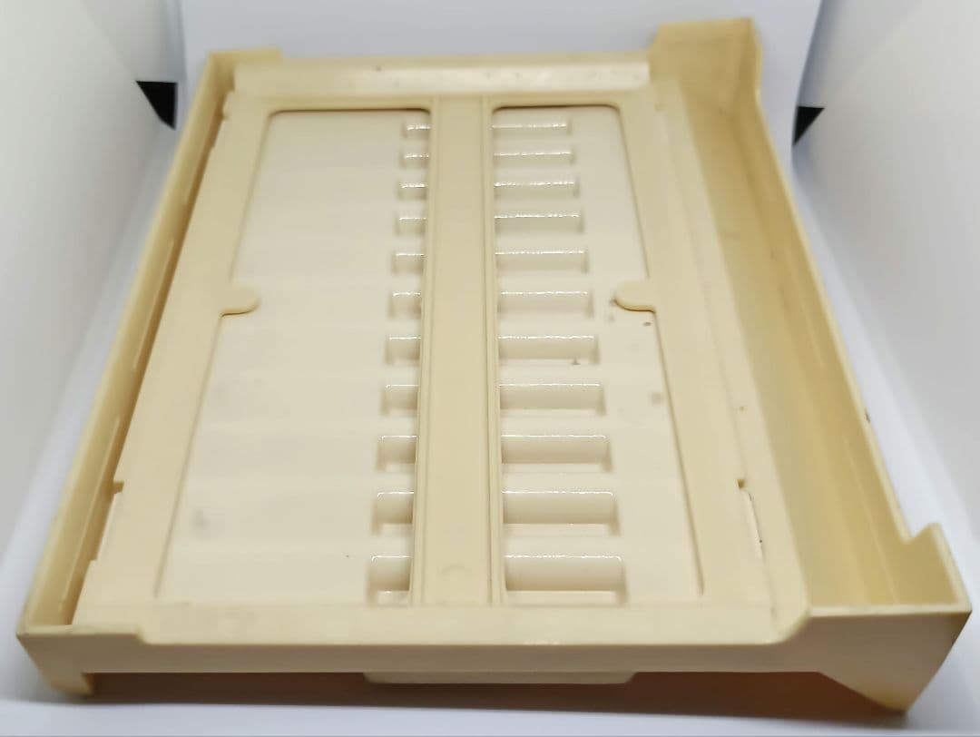 White and red Pilot pen tray with sunburned and heavily stained surface