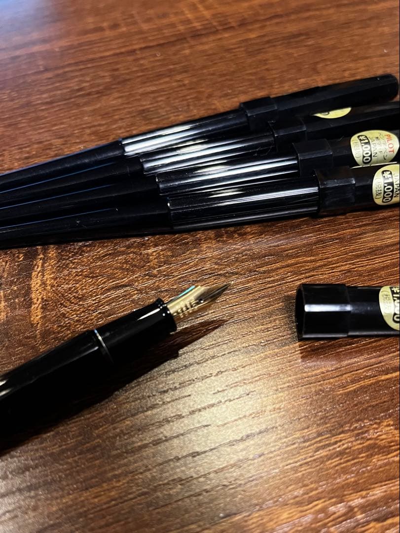 Set of five unused PILOT ultra-fine black desk pens with original price tags in dead stock packaging