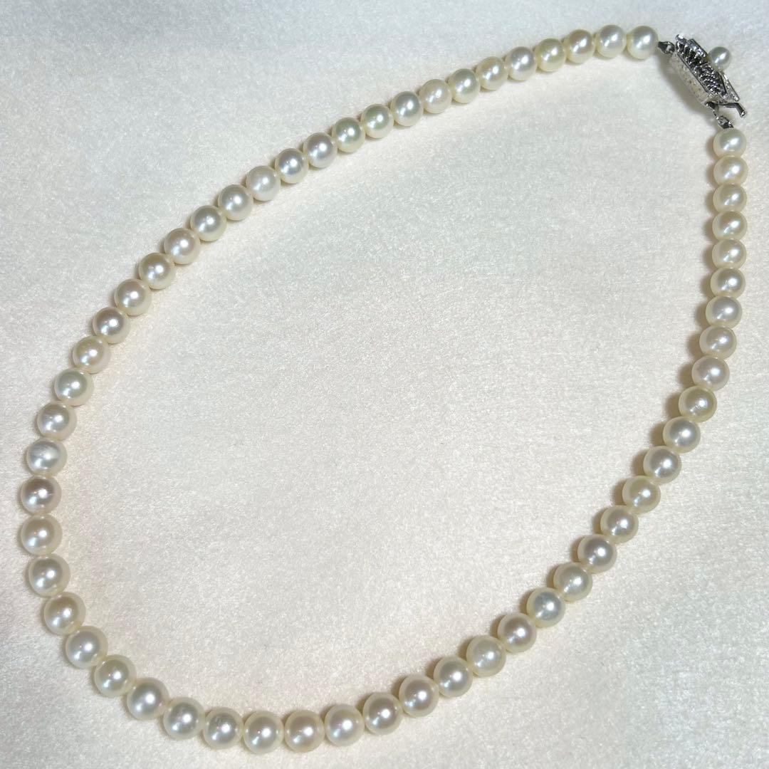 Akoya pearl necklace featuring 7mm to 6.5mm pearls on a 40cm strand with silver stamp