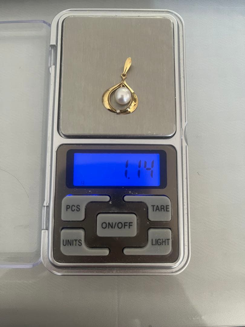 Tasaki Pearl Diamond Pendant Top in yellow gold featuring a 7mm pearl and small diamond