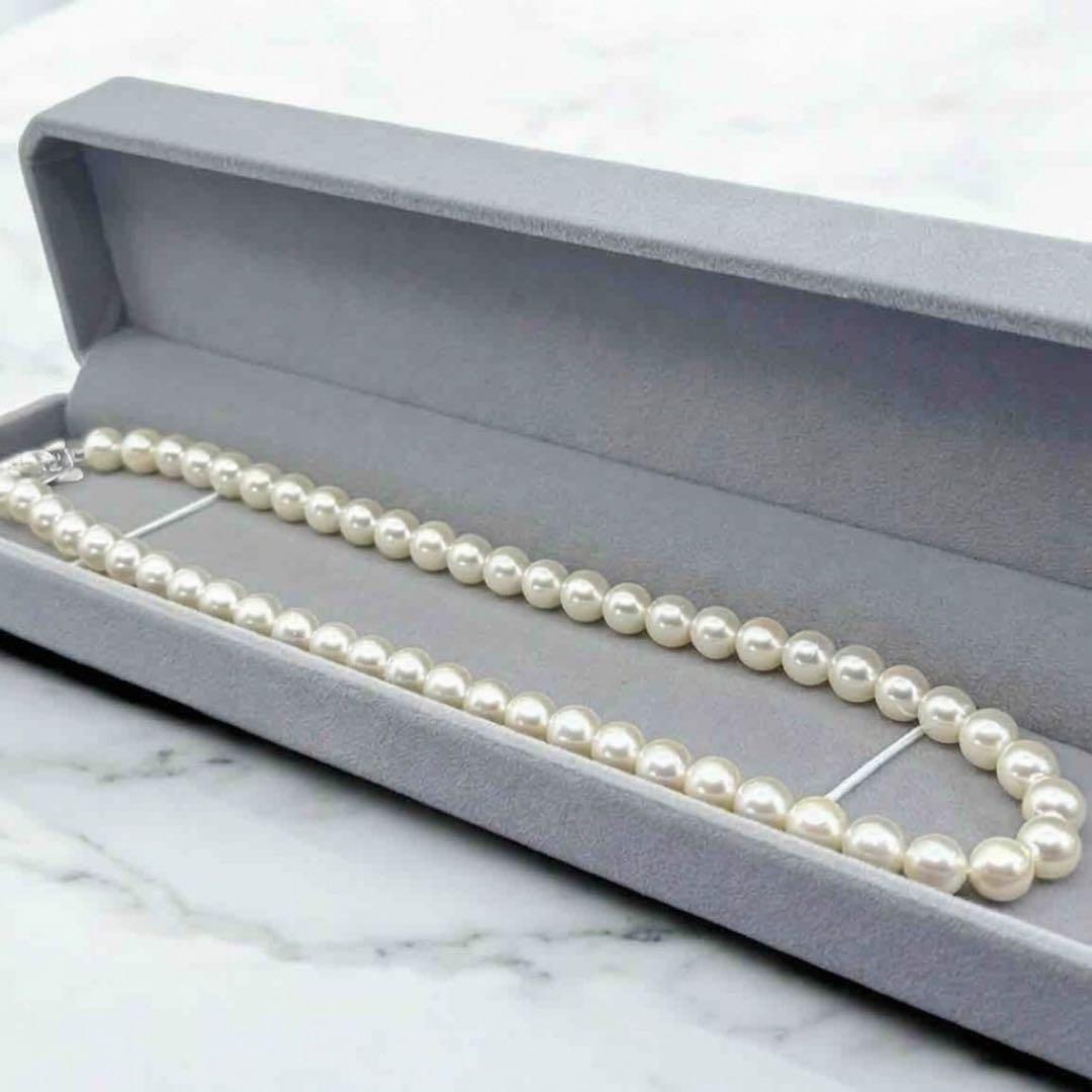 Takatsuki Akoya pearl necklace with 7.0mm round pearls and silver clasp on a white background