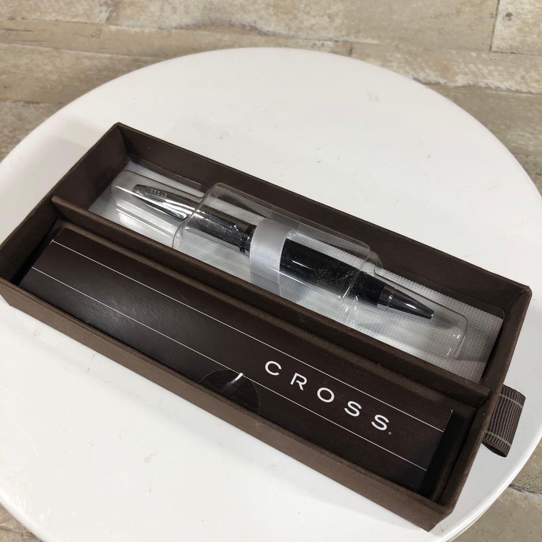 Black CROSS ballpoint pen with its protective case displayed on a white background