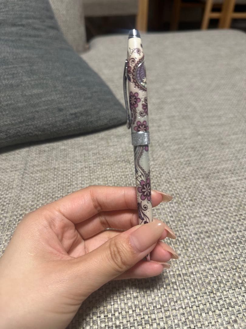 Cross ballpoint pen featuring a glittering purple Paisley pattern on the barrel