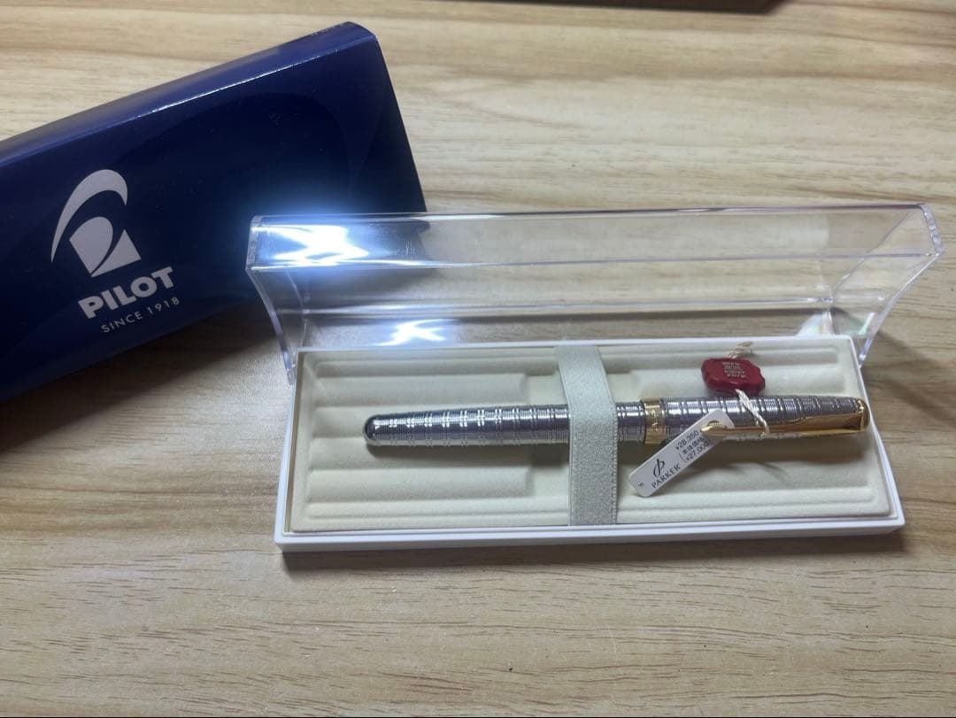 PILOT Parker fountain pen with transparent barrel, showing metal parts and original packaging
