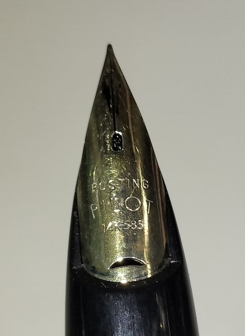Pilot E fountain pen with 14K nib showing replaced ink and used condition