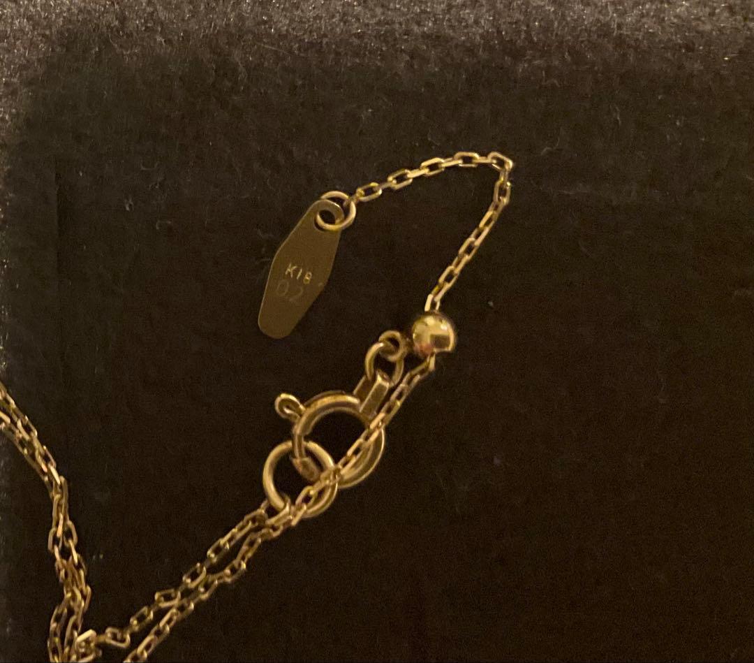 Agete K18 gold necklace featuring a 0.2ct secret cut diamond pendant