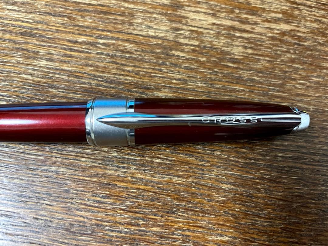 CROSS Apogee Ballpoint Pen in vivid wine red color with slight scratches on the body