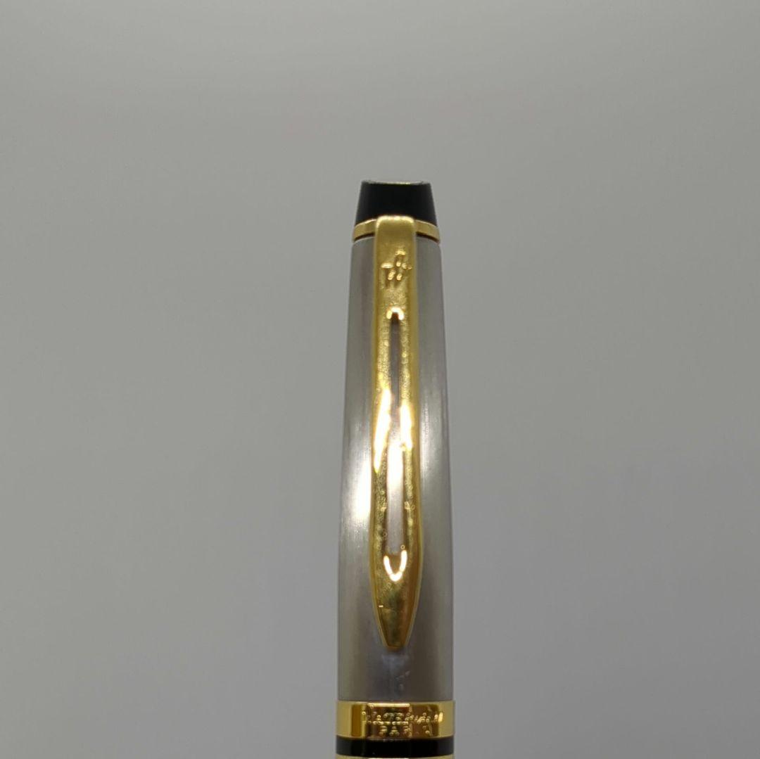 Waterman Expert ballpoint pen with steel satin finish and 23K gold trim, showing minor wear