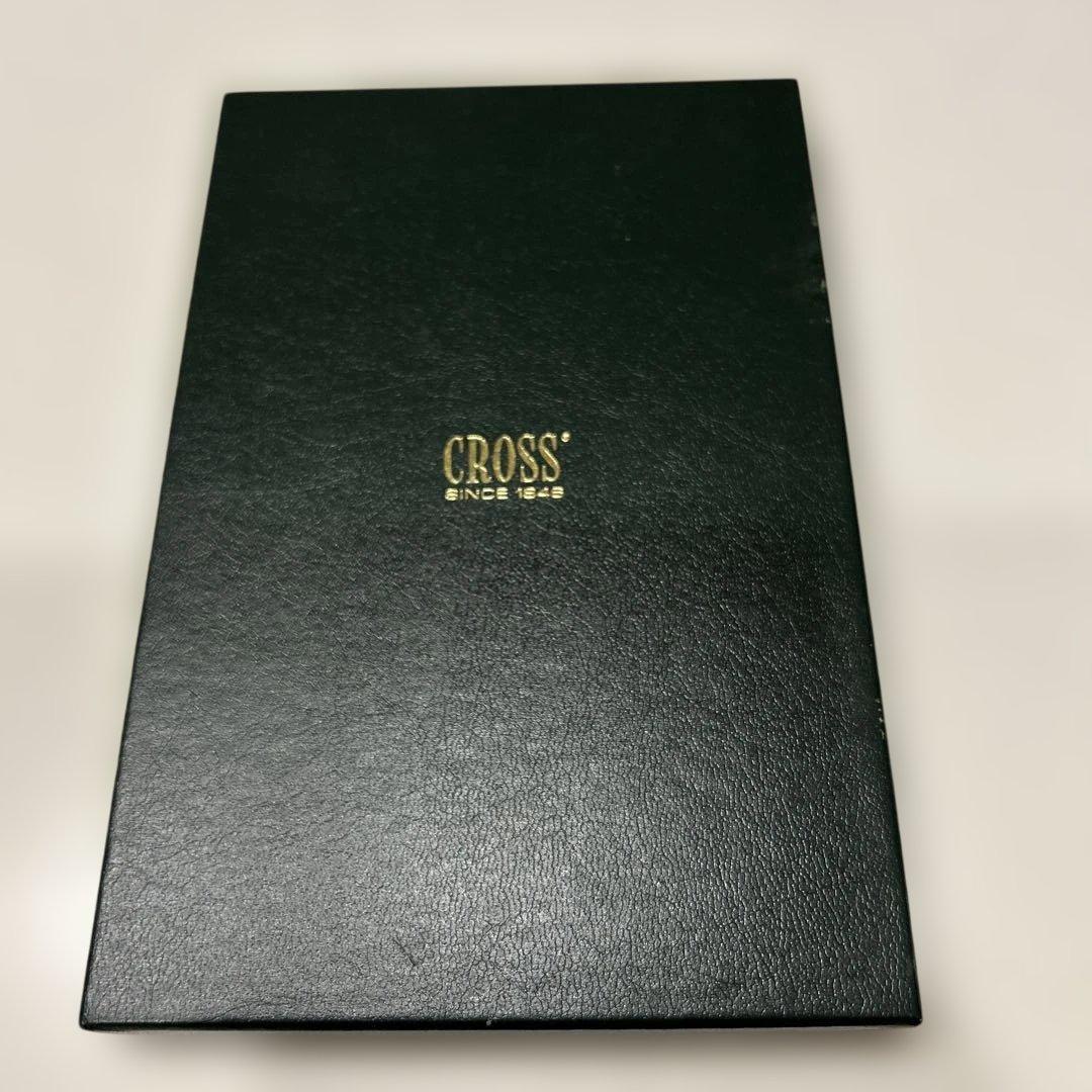 CROSS ballpoint pen with black leather case displayed on white background