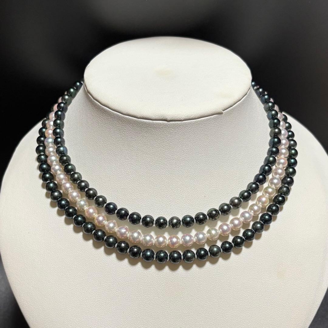 Three-strand Akoya pearl necklace with black, white, and pink round pearls measuring 6-6.5mm